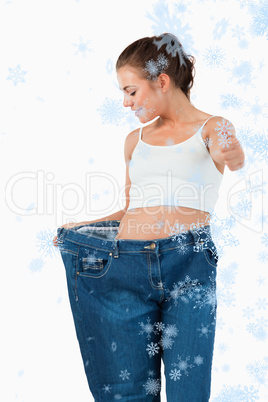 Composite image of portrait of a thin woman wearing too large je
