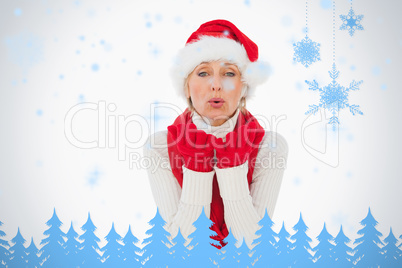 Festive woman blowing a kiss