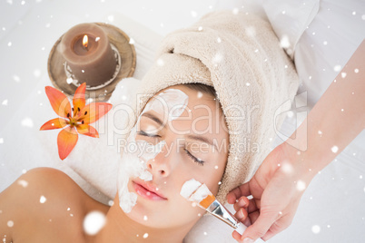 Attractive woman receiving treatment at spa center