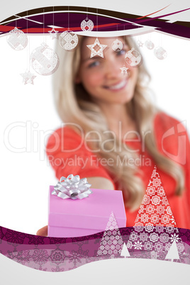 Composite image of young woman giving a gift