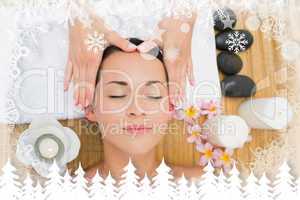 Smiling brunette enjoying a head massage