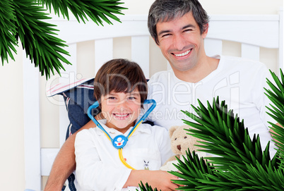 Cheerful father and his sick son playing with a stethoscope