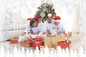 Composite image of young family unpacking christmas presents