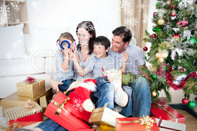 Happy family having fun with christmas presents