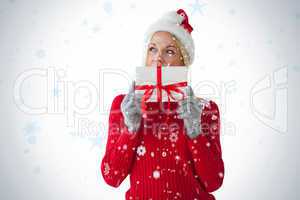 Festive blonde holding a present