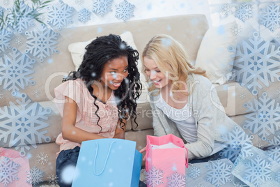 Two smiling women with shopping bags