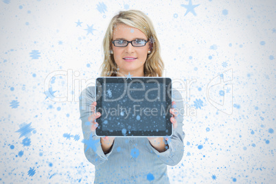 Happy woman presenting her tablet