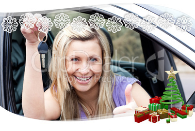 Charming female driver showing a key after bying a new car