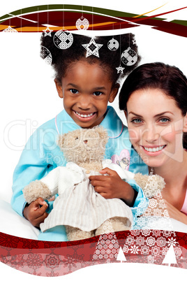 Smiling little girl with her nurse looking at the camera