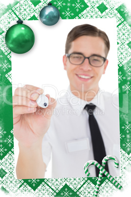 Nerdy businessman writing with black marker