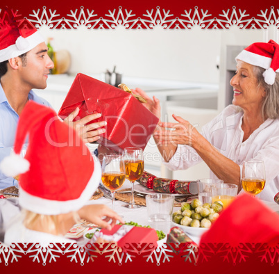 Composite image of family exchanging christmas presents