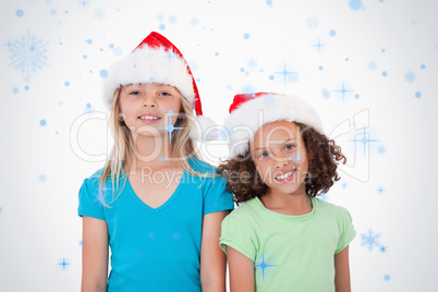 Composite image of girls with christmas hats