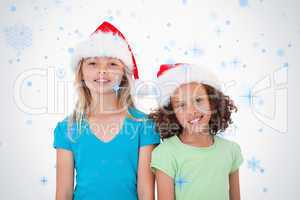 Composite image of girls with christmas hats