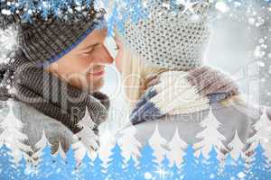 Composite image of couple in warm clothing facing each other