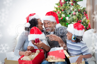 Happy family having fun with christmas presents