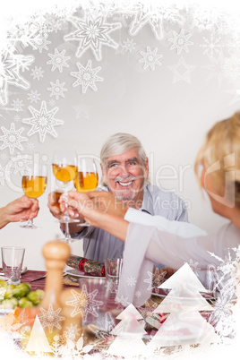 Family toasting each other at christmas