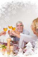 Family toasting each other at christmas