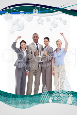 Composite image of happy business team holding a cup