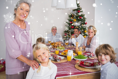 Composite image of grandmother and granddaughter standing beside