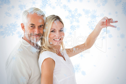 Happy couple showing their new house key