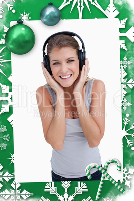 Composite image of portrait of a smiling woman listening to music