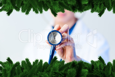 Doctor holding out stethescope with focus on object
