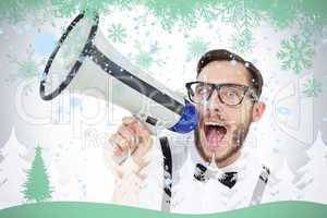 Geeky businessman shouting through megaphone