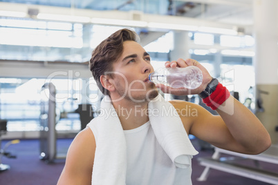 Fit man taking a break from working out