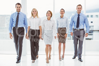 Business people walking together in office