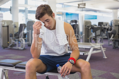 Fit man taking a break from working out