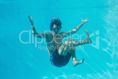 Young man wearing snorkel underwater