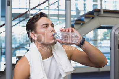 Fit man taking a break from working out