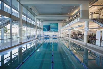 Empty swimming pool with large windows