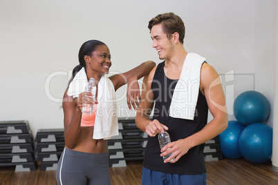 Personal trainer and client chatting