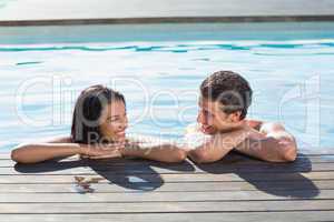 Couple in swimming pool on a sunny day