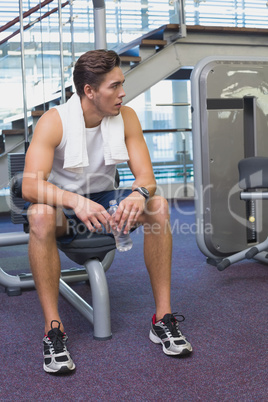 Fit man taking a break from working out