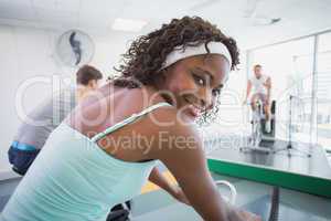 Spin class working out with motivational instructor