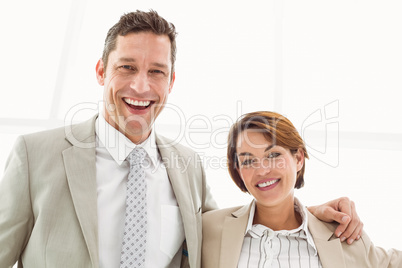 Happy business couple in office