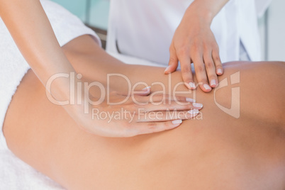 Close up of back massage at spa center