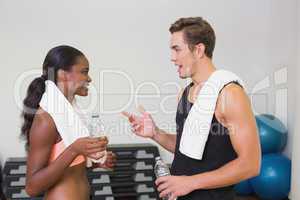 Personal trainer and client chatting