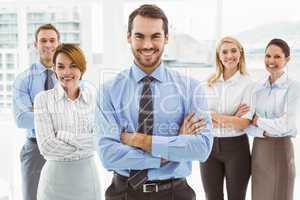 Business people with arms crossed in office