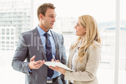 Businessman talking to his secretary