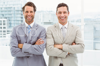 Confident happy businessmen in office