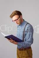 Geeky student reading a book
