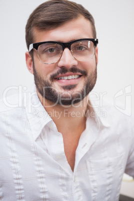 Casual businessman smiling at camera