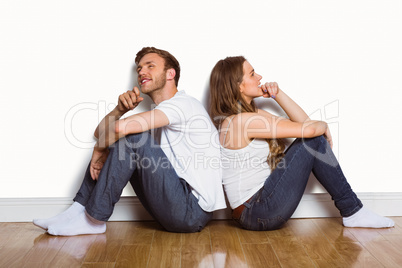 Young couple sitting on floor