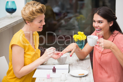 Pretty friends having a coffee