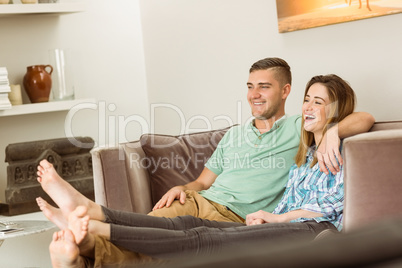 Cute couple relaxing on couch