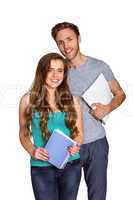 Portrait of smiling young couple with books