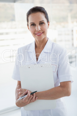 Doctor holding her work chart